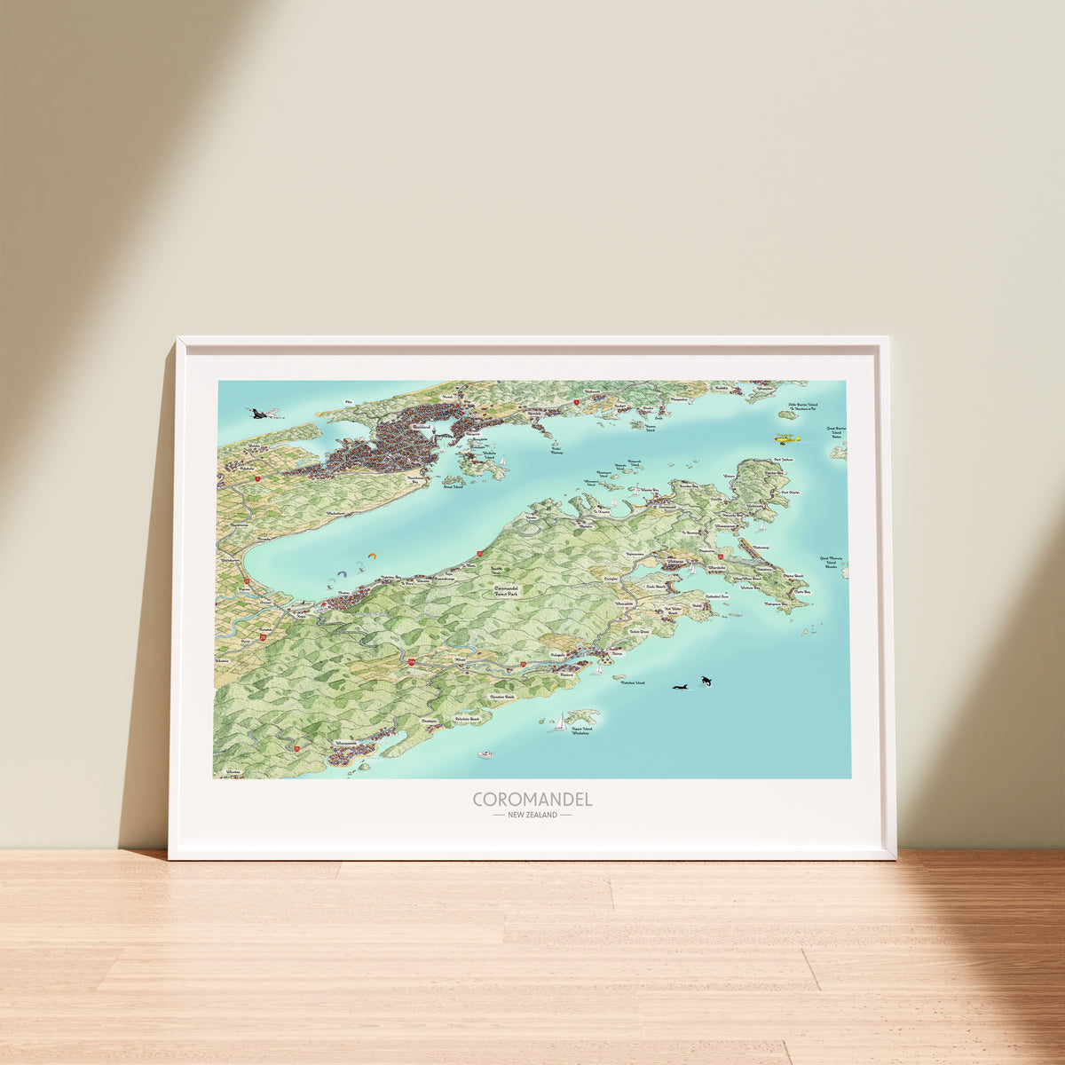 Hand-drawn map of Coromandel, New Zealand. Art Print. Watercolour style. Shows the coastline and towns. Awesome Perspective with Auckland behind. White frame displayed.