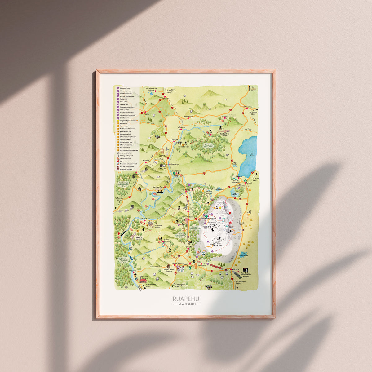 Hand-drawn watercolour map of the Ruapehu region, New Zealand. Shows all the walking tracks, points of interest, roads, and trails across the area. Created as part of a tourist flyer for Ruapehu Council. Detailed and colourful illustration with a love for watercolours, capturing the beauty of the landscape  displayed in wood frame.