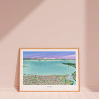 A hand-drawn map of the Taupō area in New Zealand, printed on art museum quality paper, with digital colouring showing the lake, city, and surrounding landscapes, displayed in a wood frame.