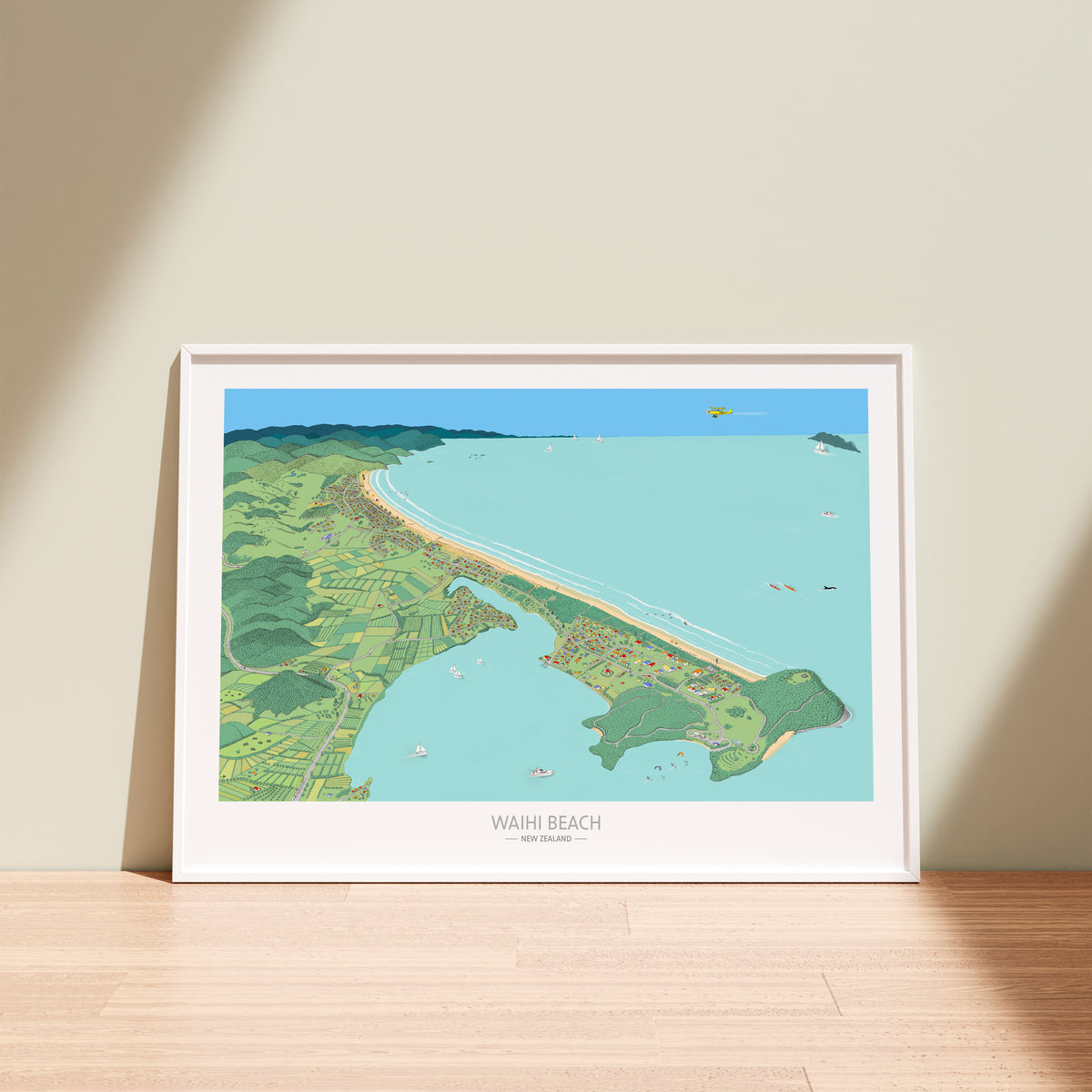 Hand drawn map of Waihi Beach, New Zealand and Bowentown peninsula art print. The illustration highlights the also Athenree, boats, and people enjoying the beach. White Frame display.