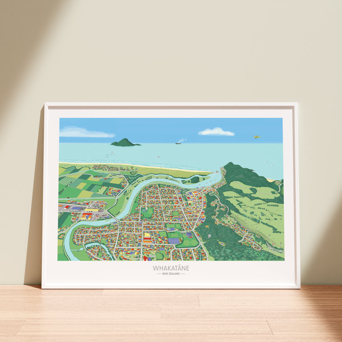 A hand-drawn map art print of Whakatāne, New Zealand. The illustration uses a playful perspective to highlight the Whakatāne River, Mokoroa Reserve, and Moutohora Island. White frame displayed